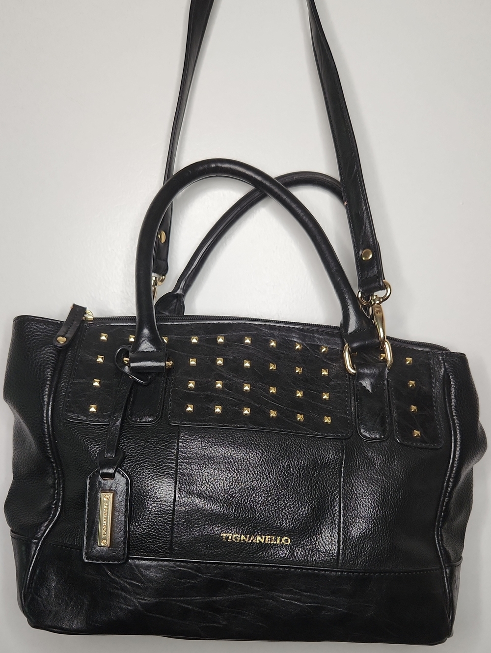 Tignanello Black leather shoulder bag w/gold studs. EUC Preloved item sold as is